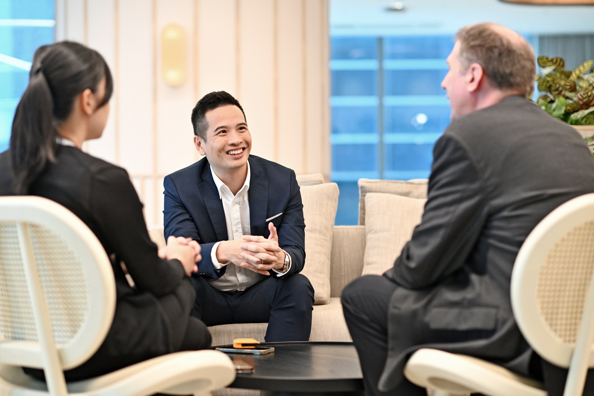 A team of young and diversified business executives in a meeting discussion