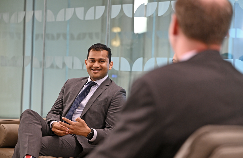 Older hands handing earth to younger hands 