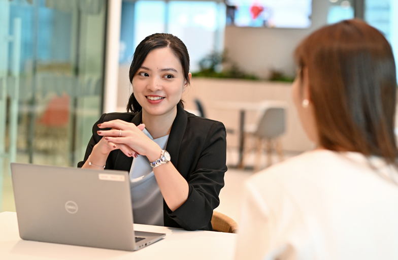 Older hands handing earth to younger hands 