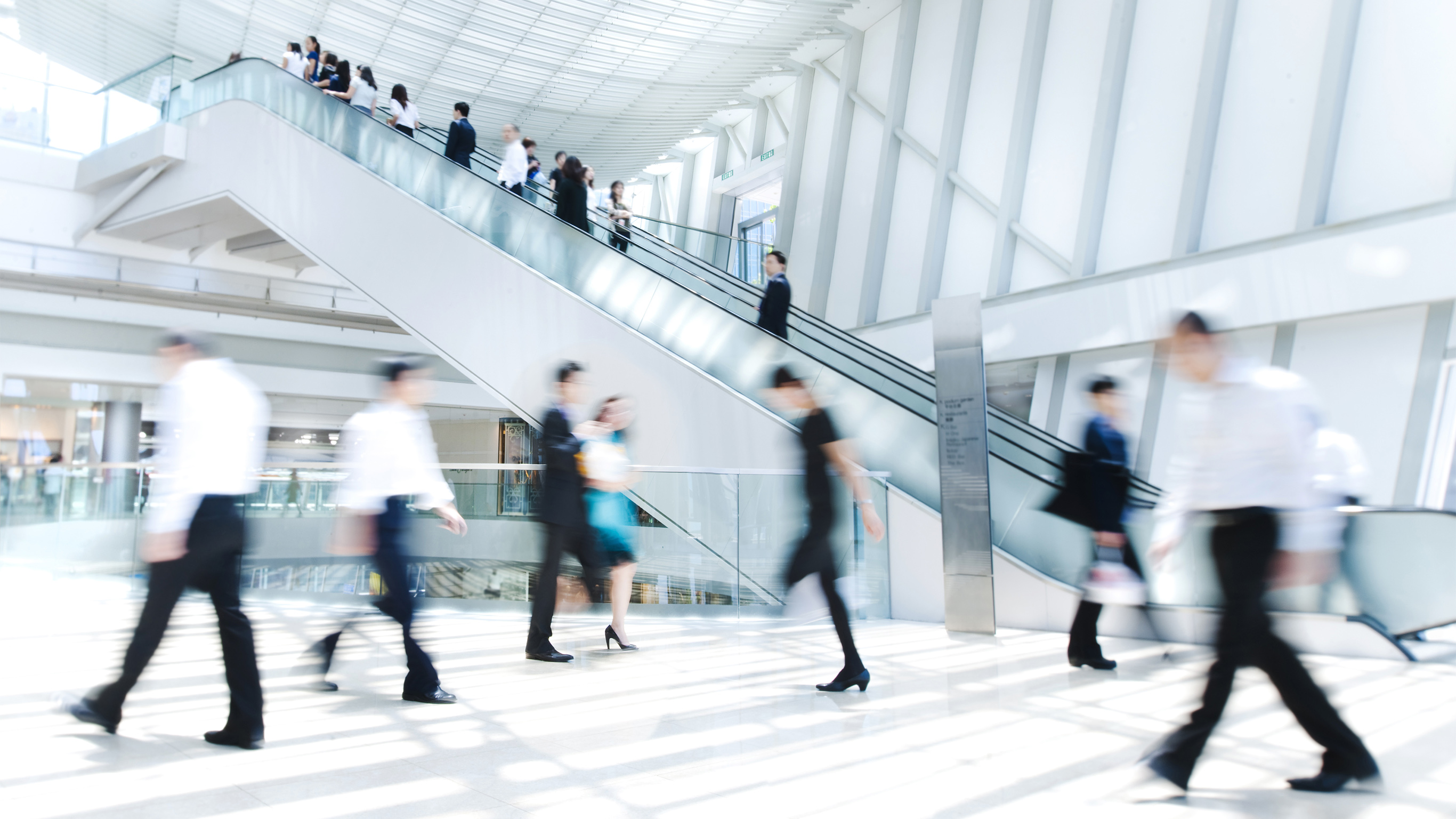 Business executives on the move in a commercial building